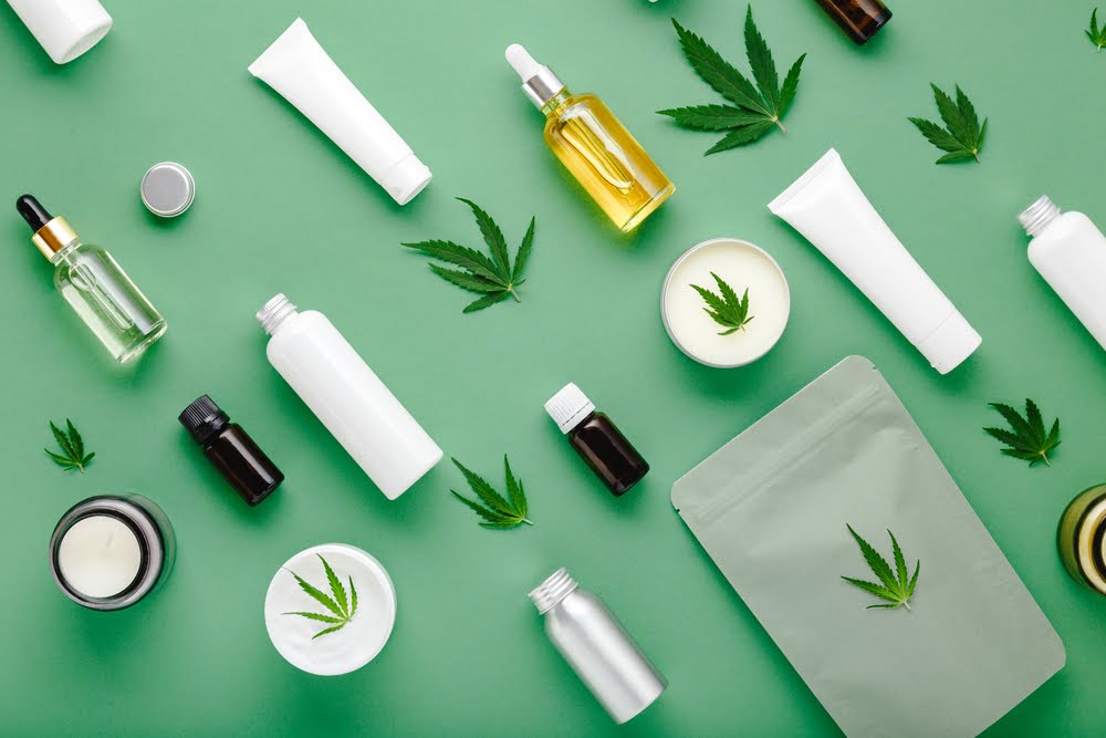 selection of THC products laying on a green counter top