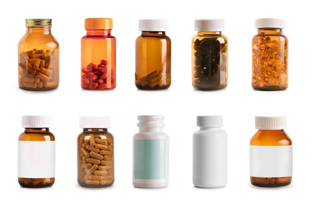selection of supplement bottles all with empty labels