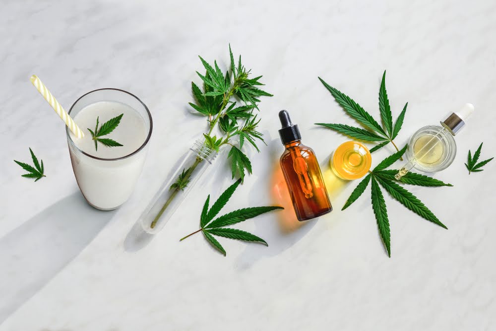 white marble counter top with a selection of tinctures and thc-infused drinks