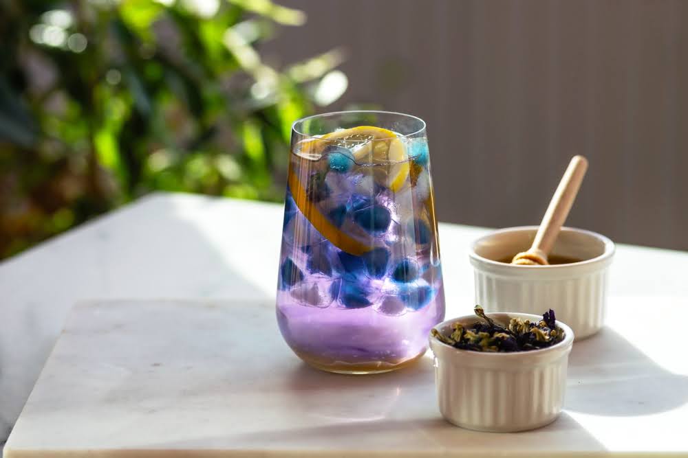 hemp-derived drink on a counter with clove and lemon
