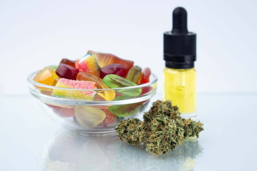 selection of cannabis product types on a neutral colored backdrop